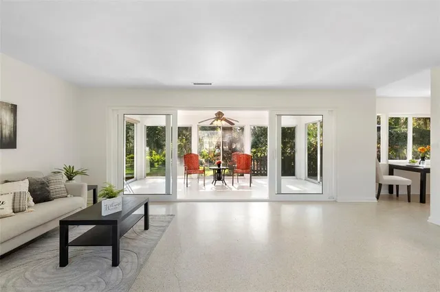 a living room with furniture and a window