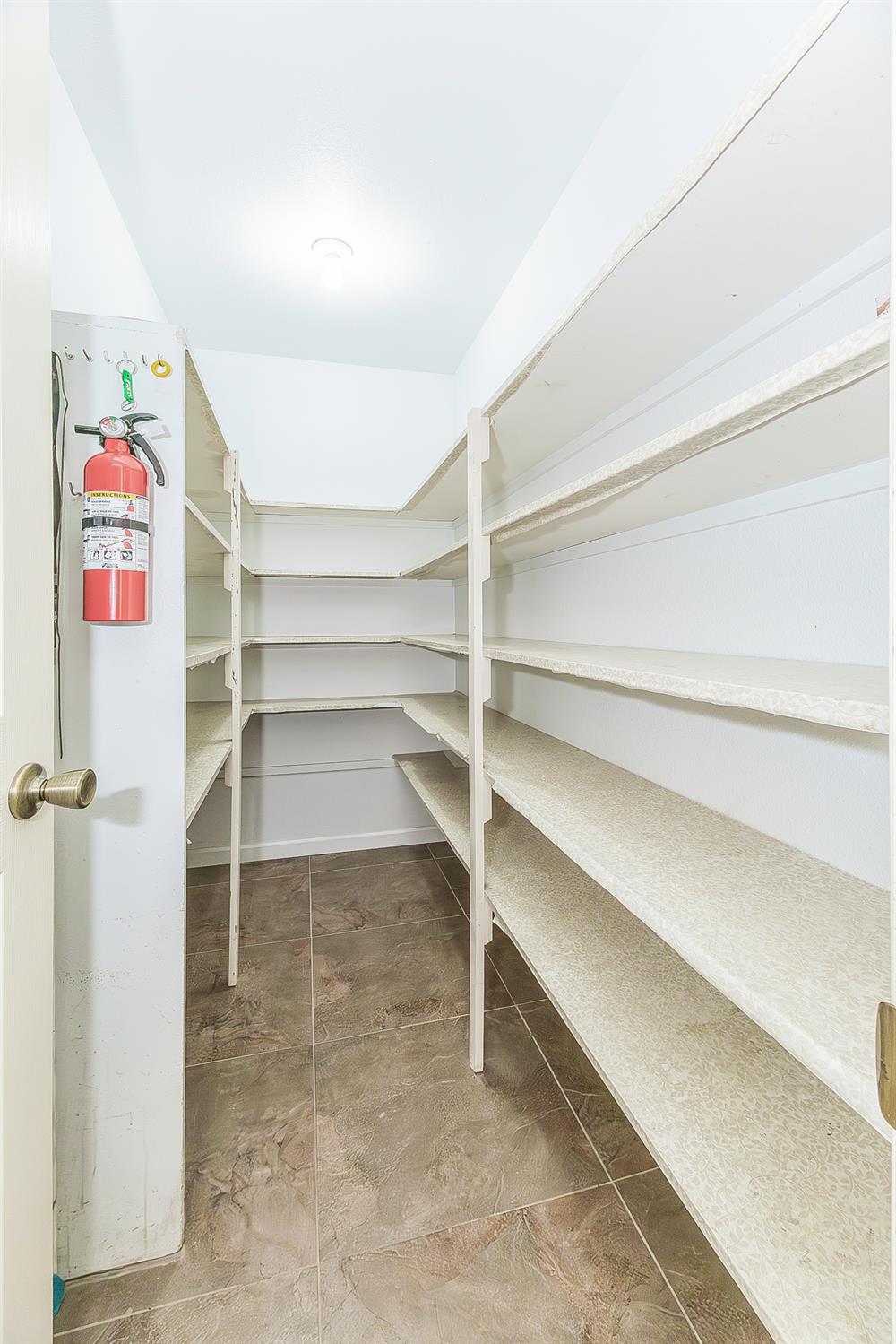 45991 Black Oak Road Coarsegold, CA 93614 - Photo 15 of 67 a view of walk in closet with empty racks