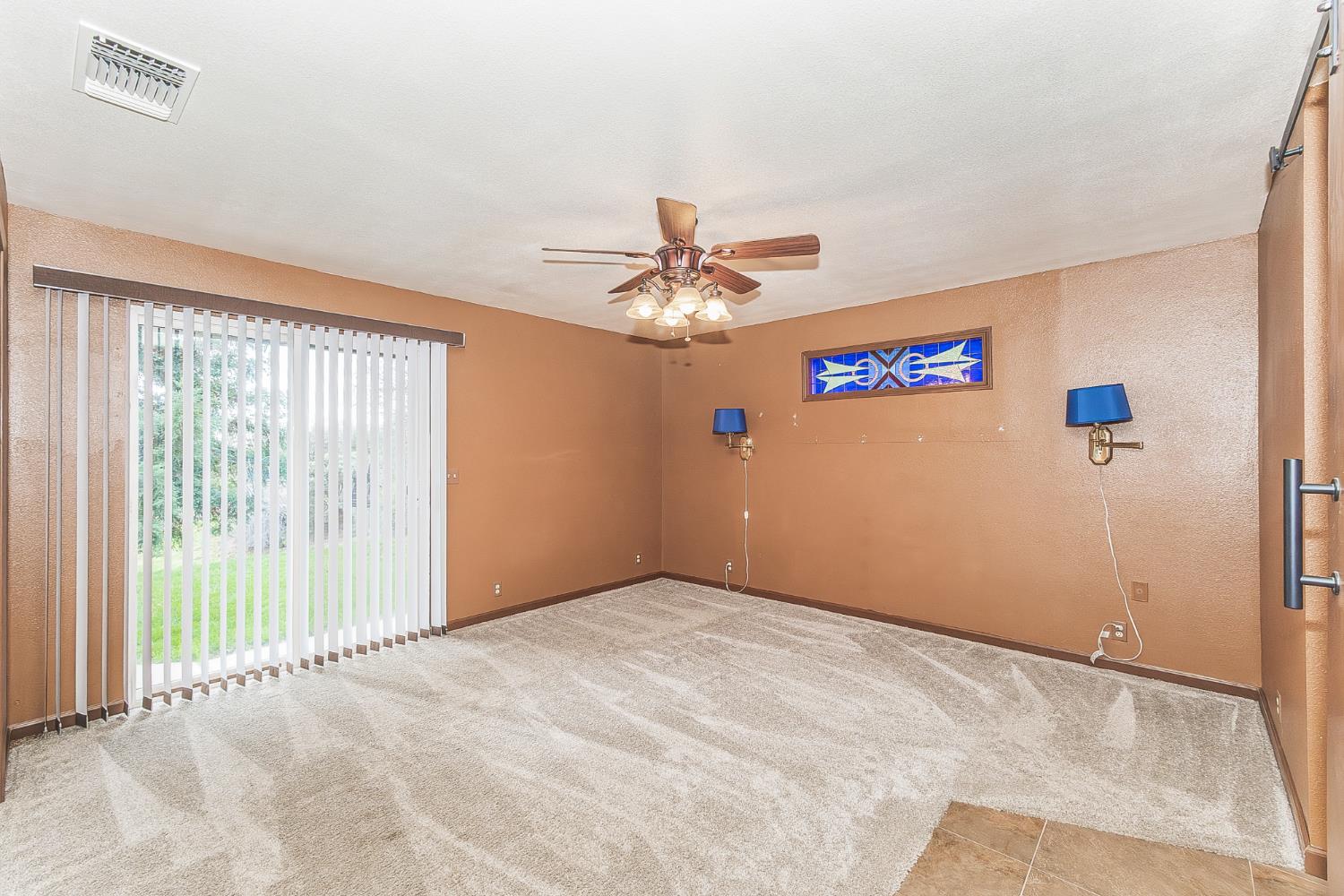 45991 Black Oak Road Coarsegold, CA 93614 - Photo 16 of 67 a view of a livingroom with a ceiling fan and window