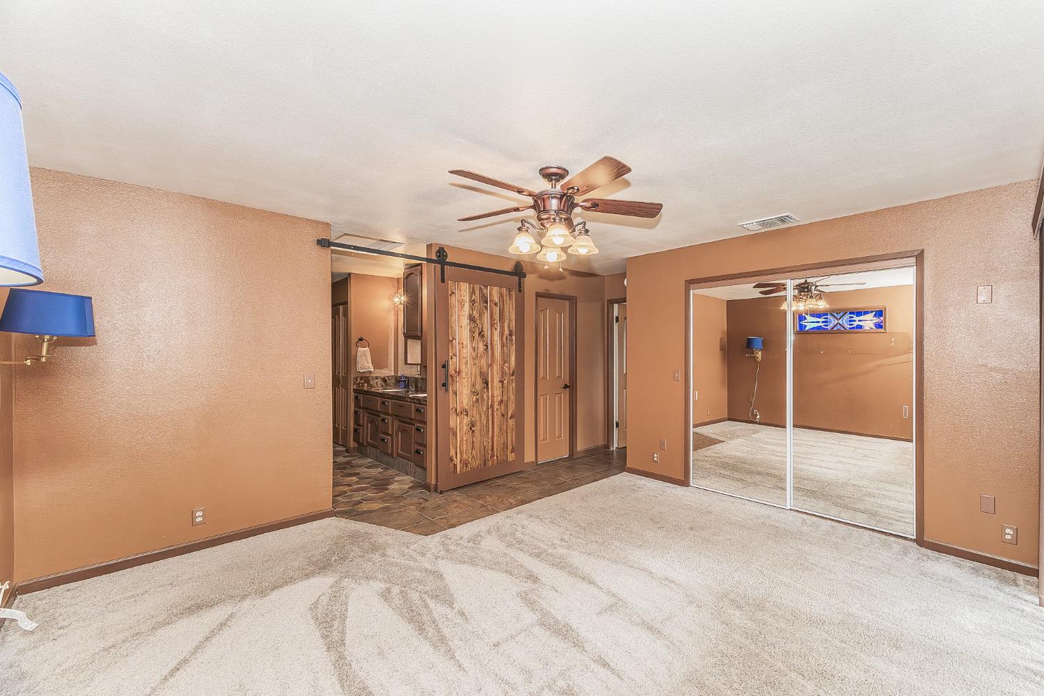 45991 Black Oak Road Coarsegold, CA 93614 - Photo 18 of 67 a view of a livingroom with a ceiling fan and window