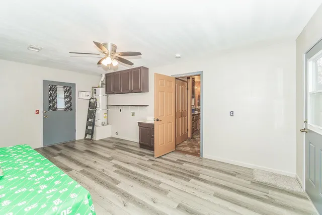 a spacious bathroom with a double vanity sink toilet and shower