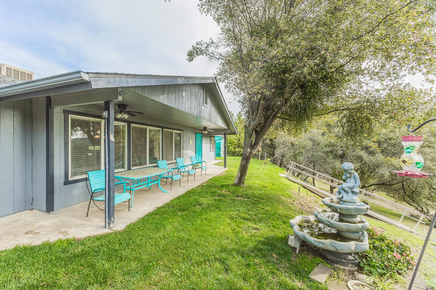 45991 Black Oak Road Coarsegold, CA 93614 - Photo 3 of 67 a view of a house with backyard porch and sitting area