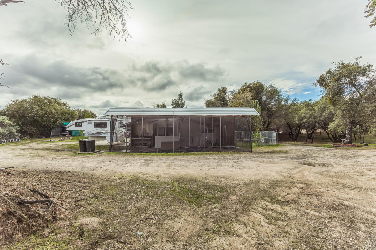 45991 Black Oak Road Coarsegold, CA 93614 - Photo 44 of 49 a street view with residential house