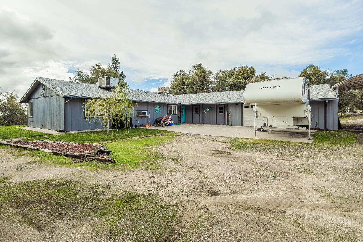45991 Black Oak Road Coarsegold, CA 93614 - Photo 47 of 67 a view of house with yard and glass windows