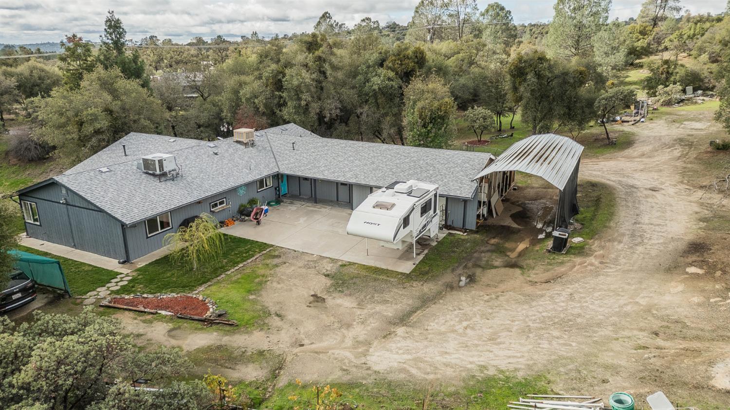 45991 Black Oak Road Coarsegold, CA 93614 - Photo 47 of 49 a view of a house with a yard and sitting area