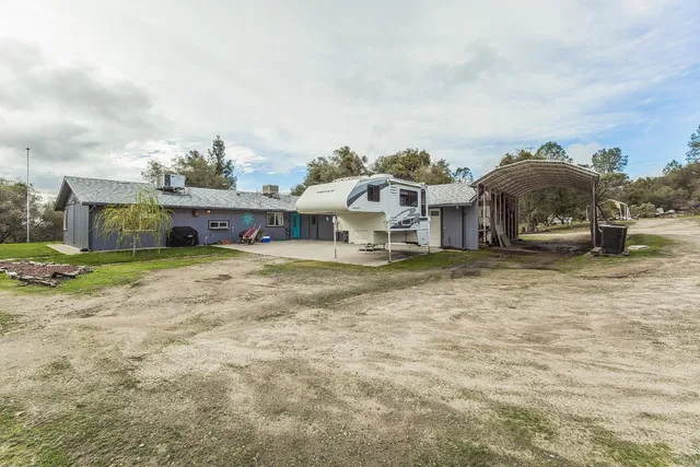 an aerial view of a house with yard and outdoor space