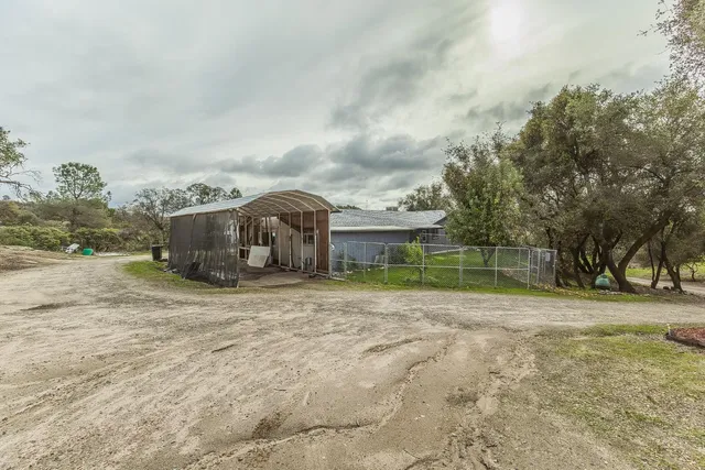 an aerial view of house with yard