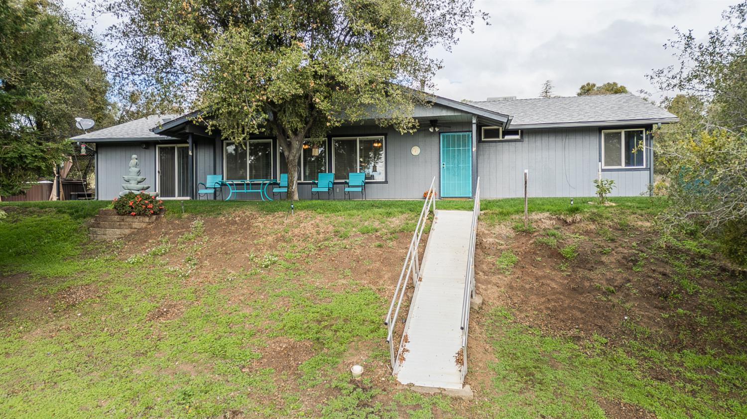 45991 Black Oak Road Coarsegold, CA 93614 - Photo 54 of 67 a front view of a house with garden