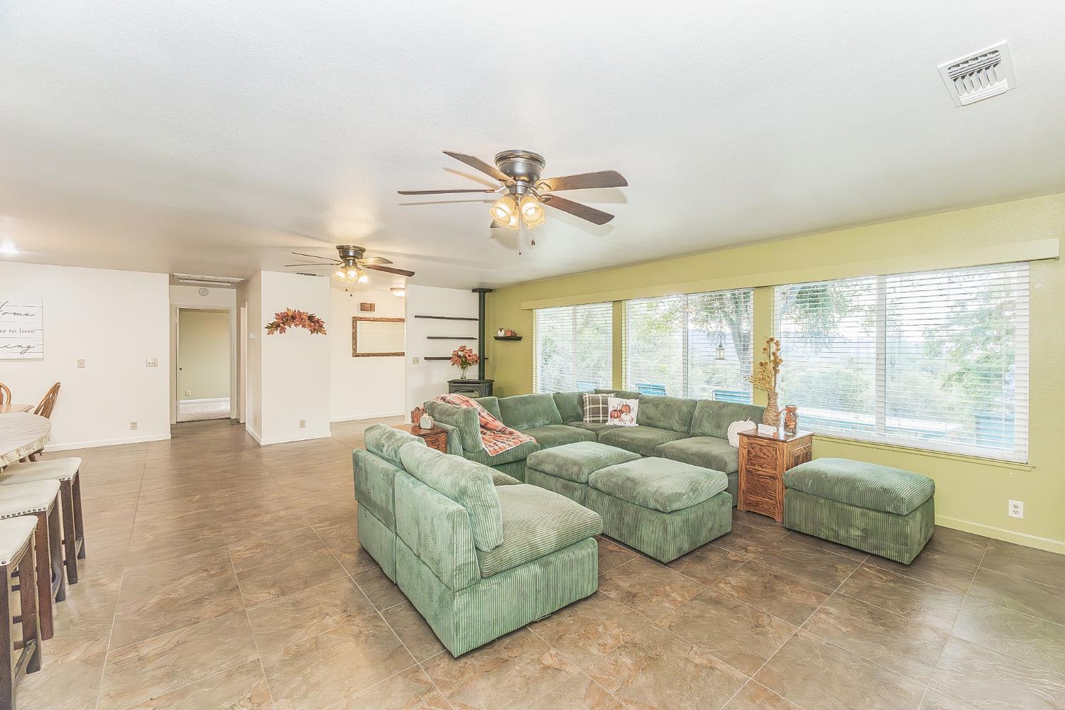 45991 Black Oak Road Coarsegold, CA 93614 - Photo 6 of 67 a living room with furniture and large windows