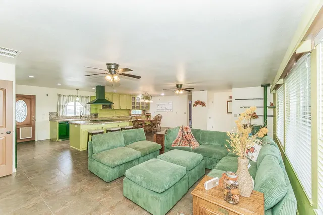a large kitchen with a table and chairs