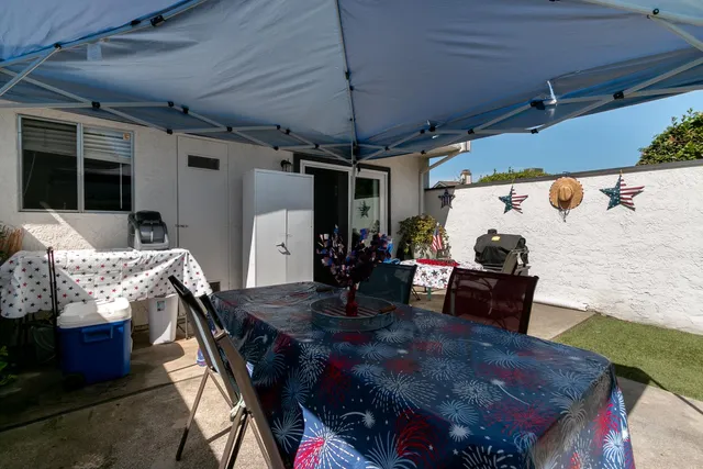 a outdoor living space with furniture and a fireplace