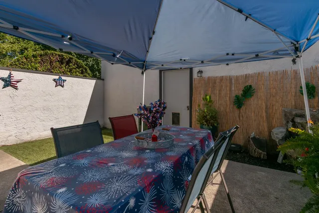 a dining room with furniture and wooden floor
