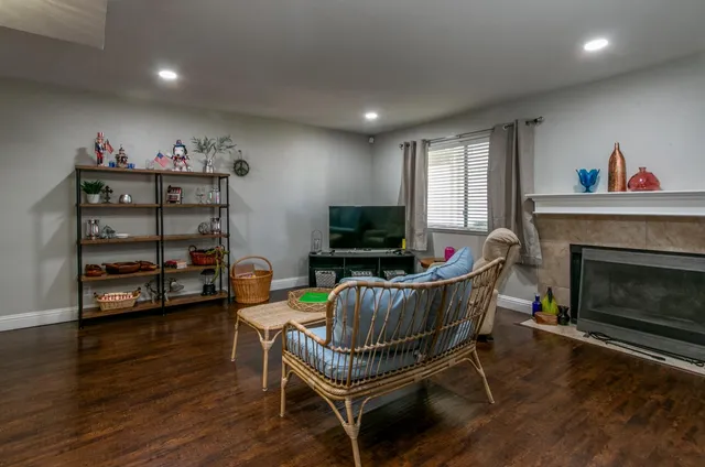 a living room with furniture and a fireplace