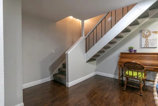 a view of entryway with wooden floor and stairs