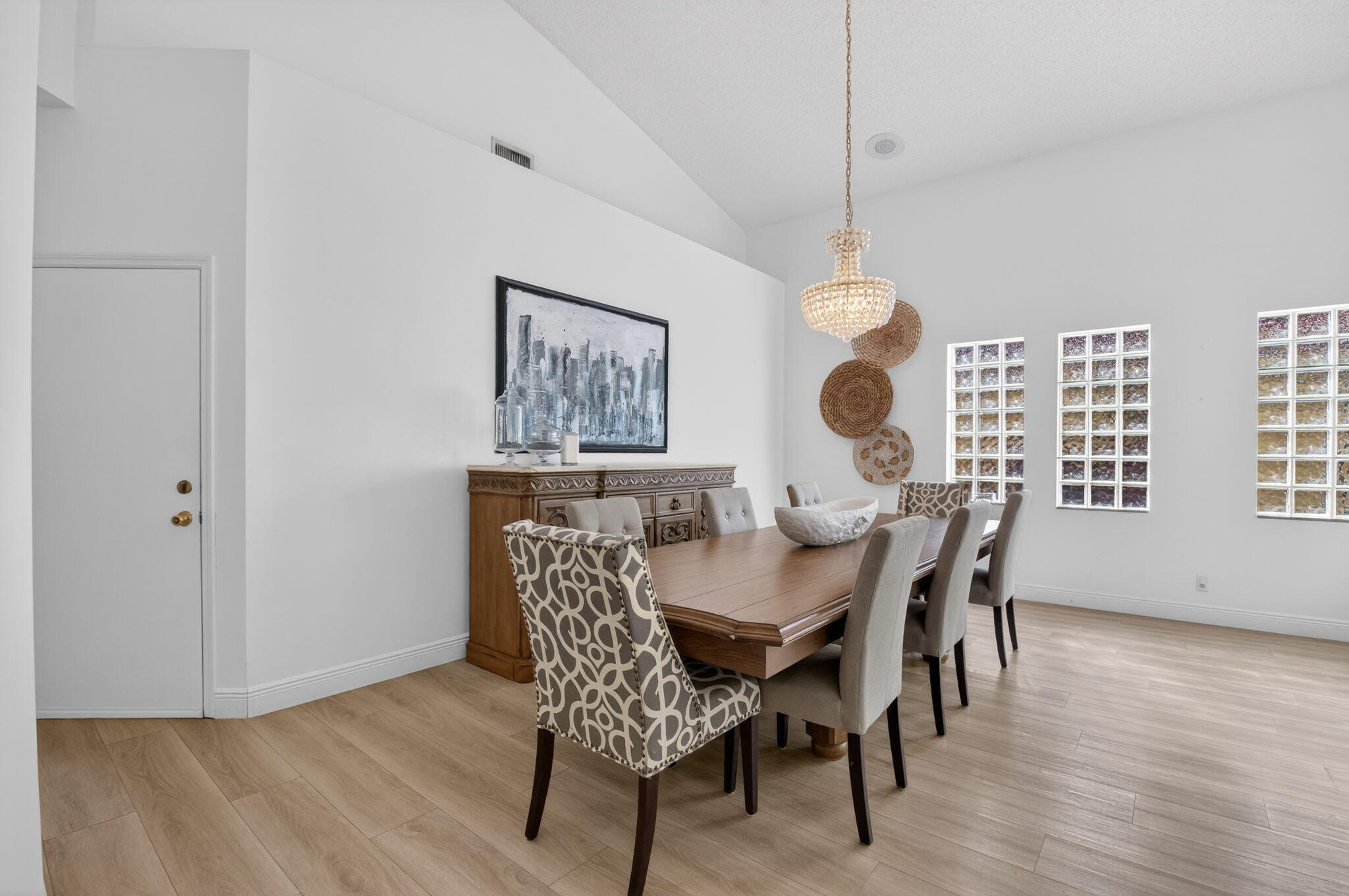 9060 Villa Portofino Circle Boca Raton, FL 33496 - Photo 15 of 47 a dining room with furniture and window