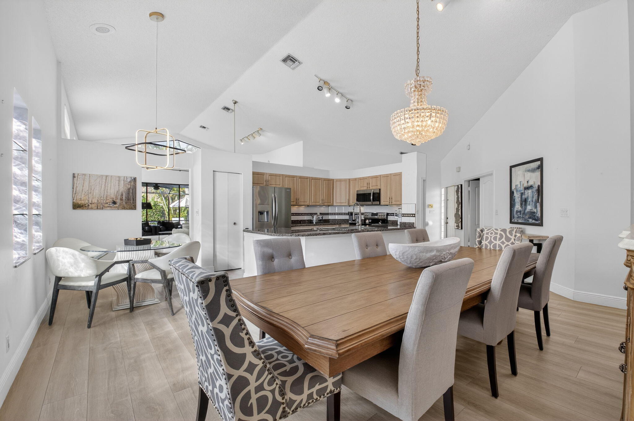 9060 Villa Portofino Circle Boca Raton, FL 33496 - Photo 16 of 47 a view of a dining room with furniture and wooden floor