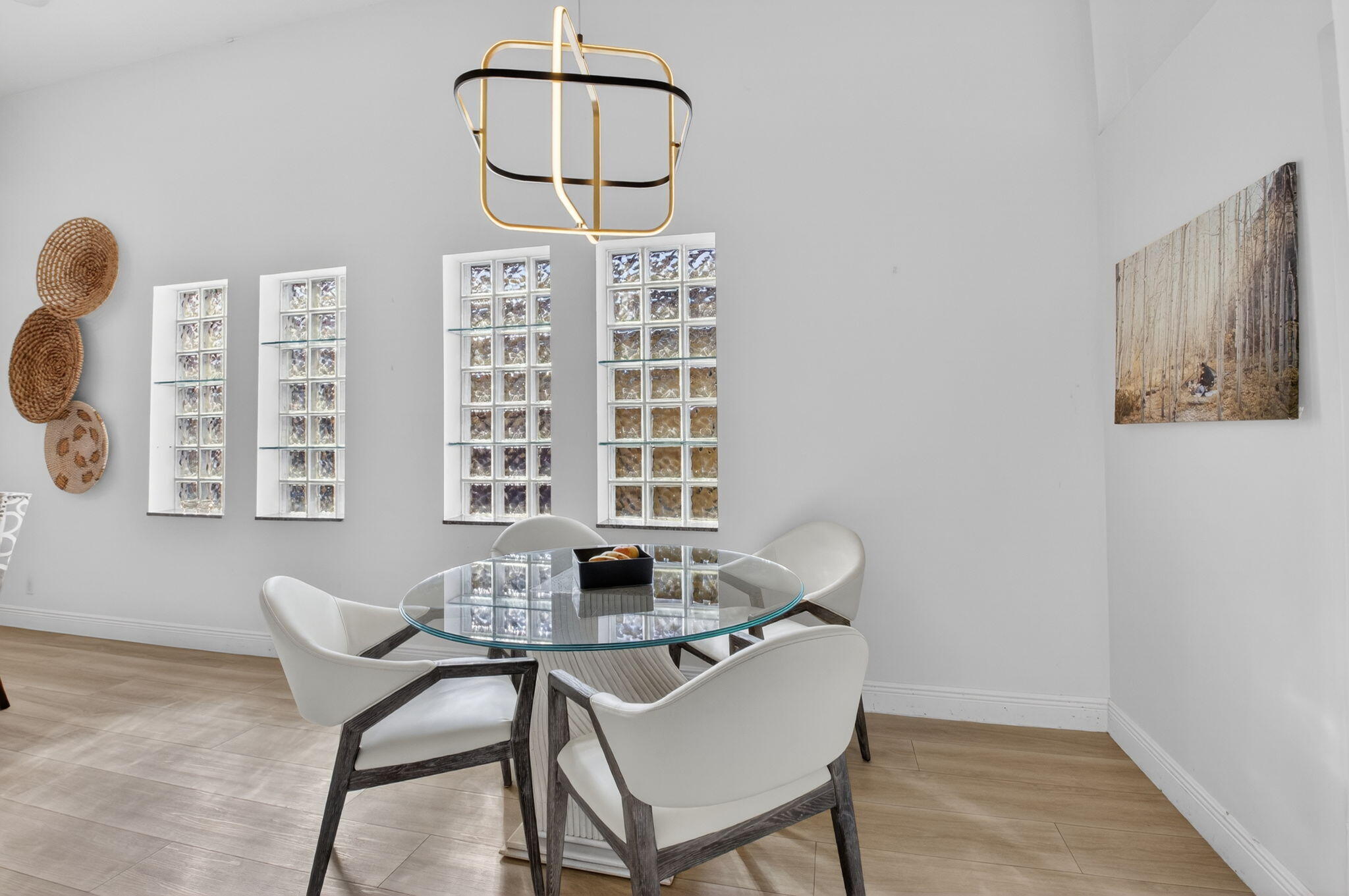 9060 Villa Portofino Circle Boca Raton, FL 33496 - Photo 18 of 47 a view of a dining room with furniture and chandelier