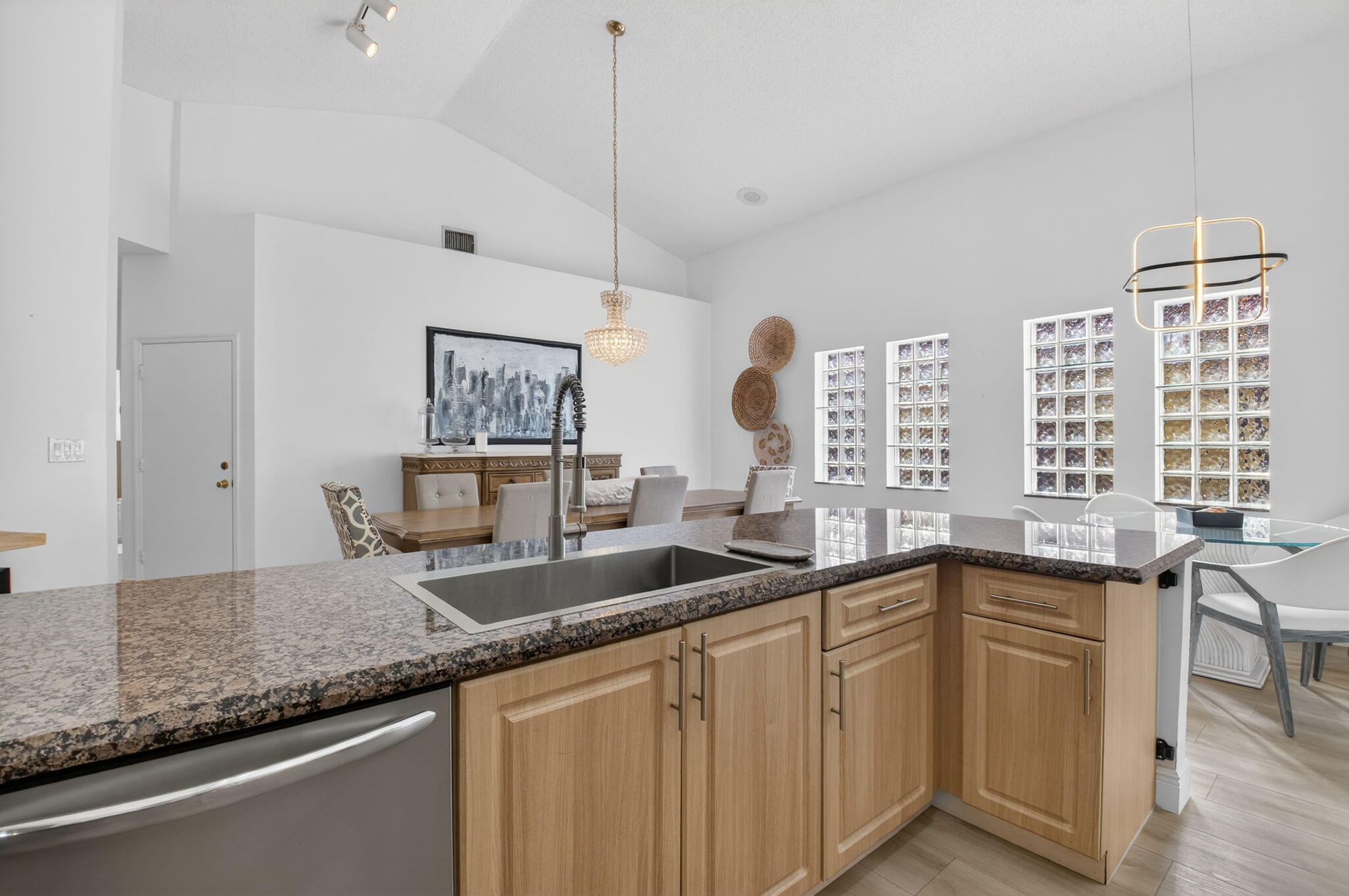 9060 Villa Portofino Circle Boca Raton, FL 33496 - Photo 23 of 47 a kitchen with lots of counter space and a sink