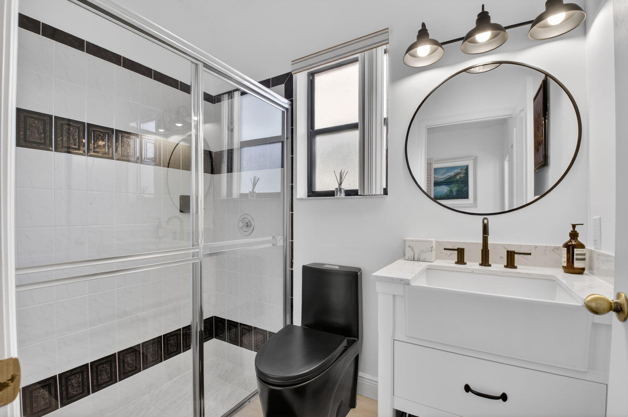 9060 Villa Portofino Circle Boca Raton, FL 33496 - Photo 30 of 47 a bathroom with a sink a toilet and a mirror