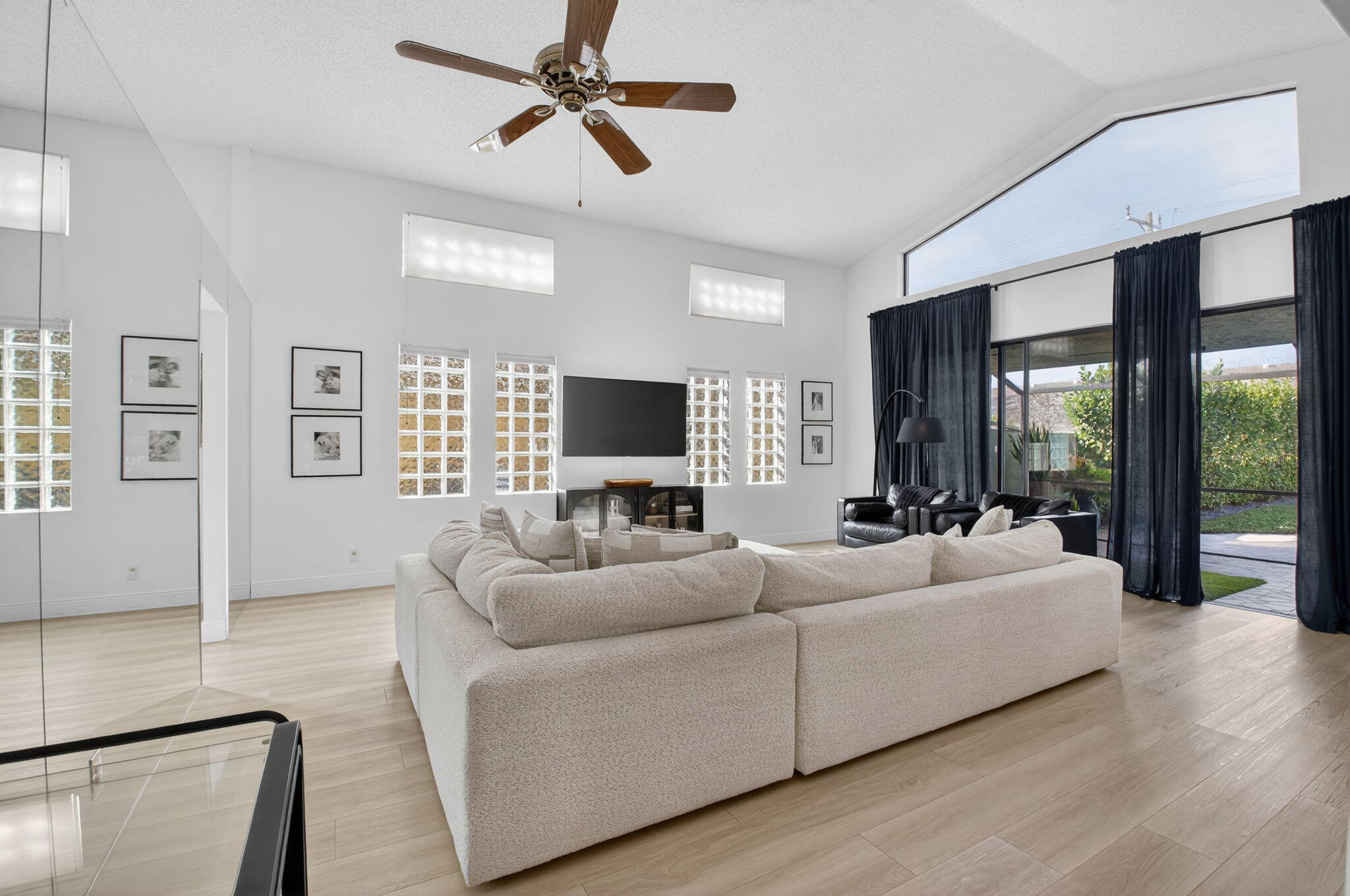 9060 Villa Portofino Circle Boca Raton, FL 33496 - Photo 5 of 47 a living room with furniture and a flat screen tv