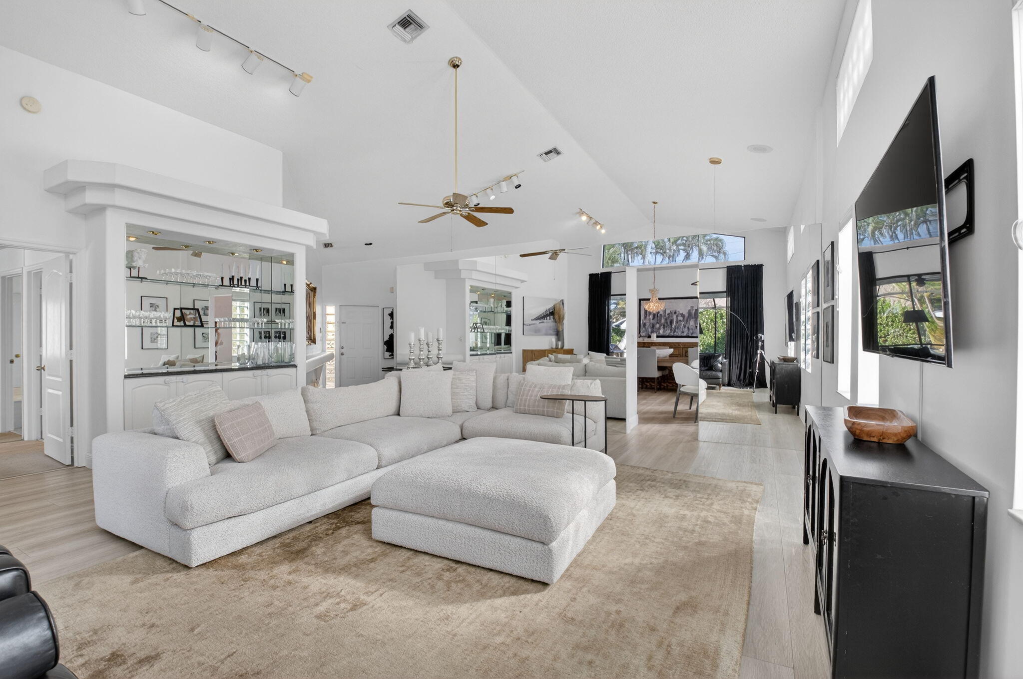 9060 Villa Portofino Circle Boca Raton, FL 33496 - Photo 10 of 47 a living room with furniture and a flat screen tv