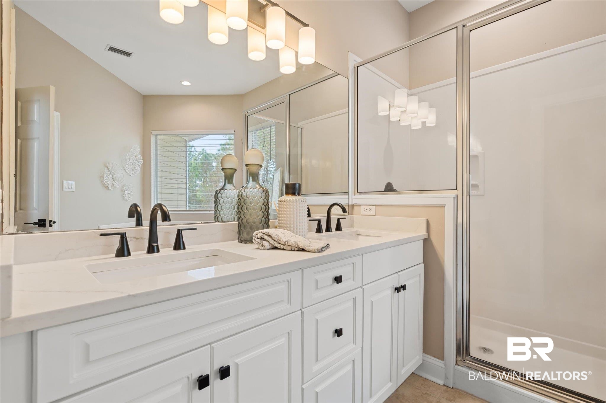 9259 Genipa Way Gulf Shores, AL 36542 - Photo 30 of 72 Bathroom with tile patterned flooring, vanity, and a shower with shower door