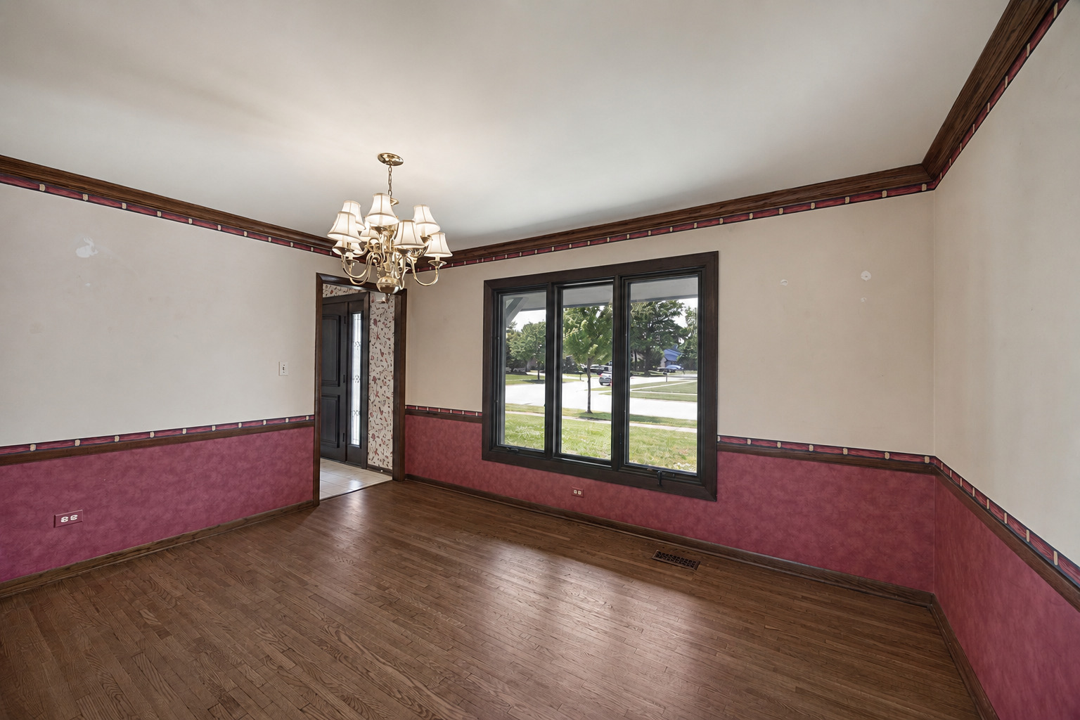 6723 Kingswood Road Willowbrook, IL 60527 - Photo 11 of 51 a living room with furniture and a chandelier
