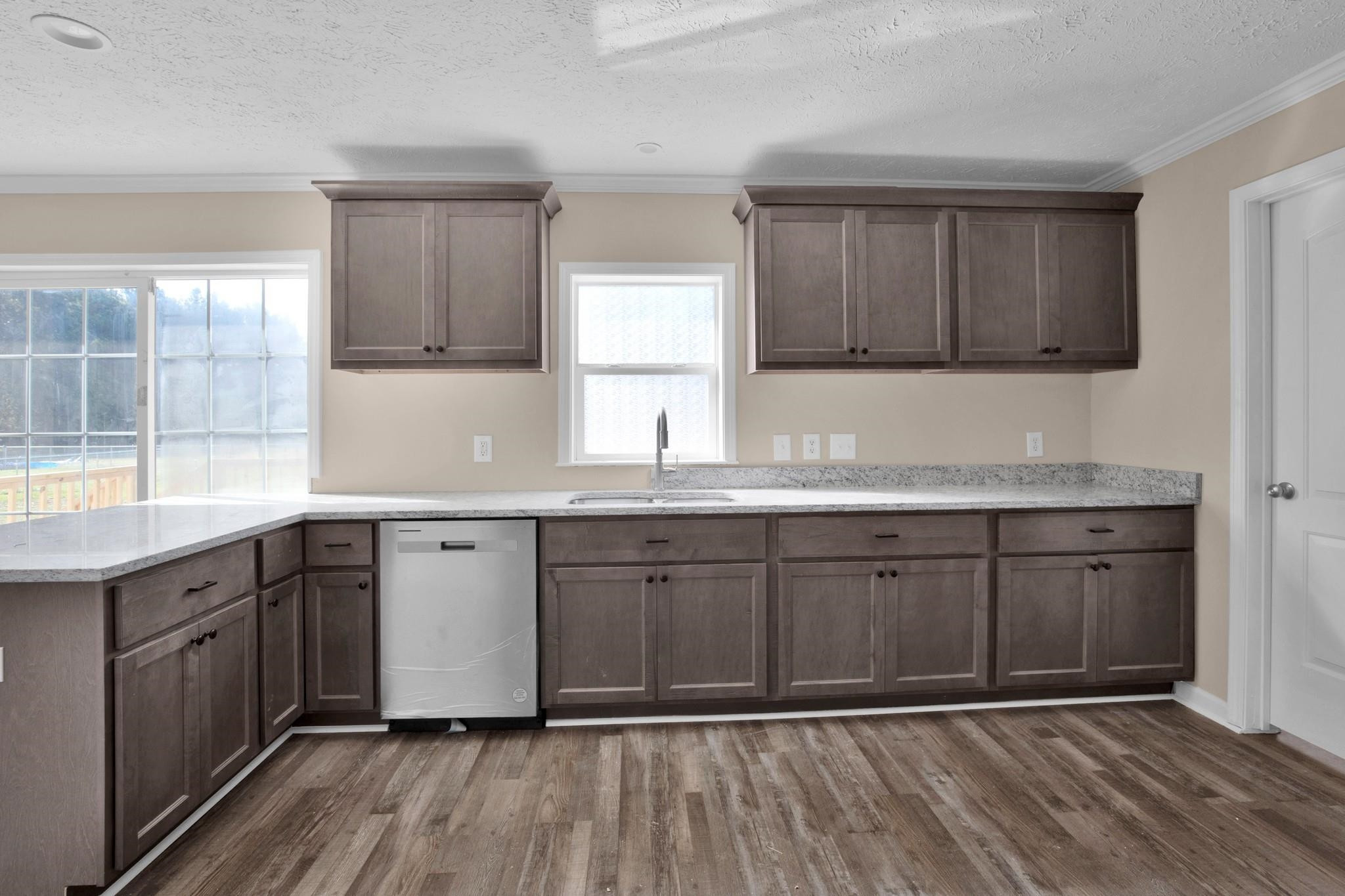 2380 Byrds Mill Road Erwin, NC 28339 - Photo 12 of 36 a kitchen with granite countertop cabinets stainless steel appliances a sink and a window