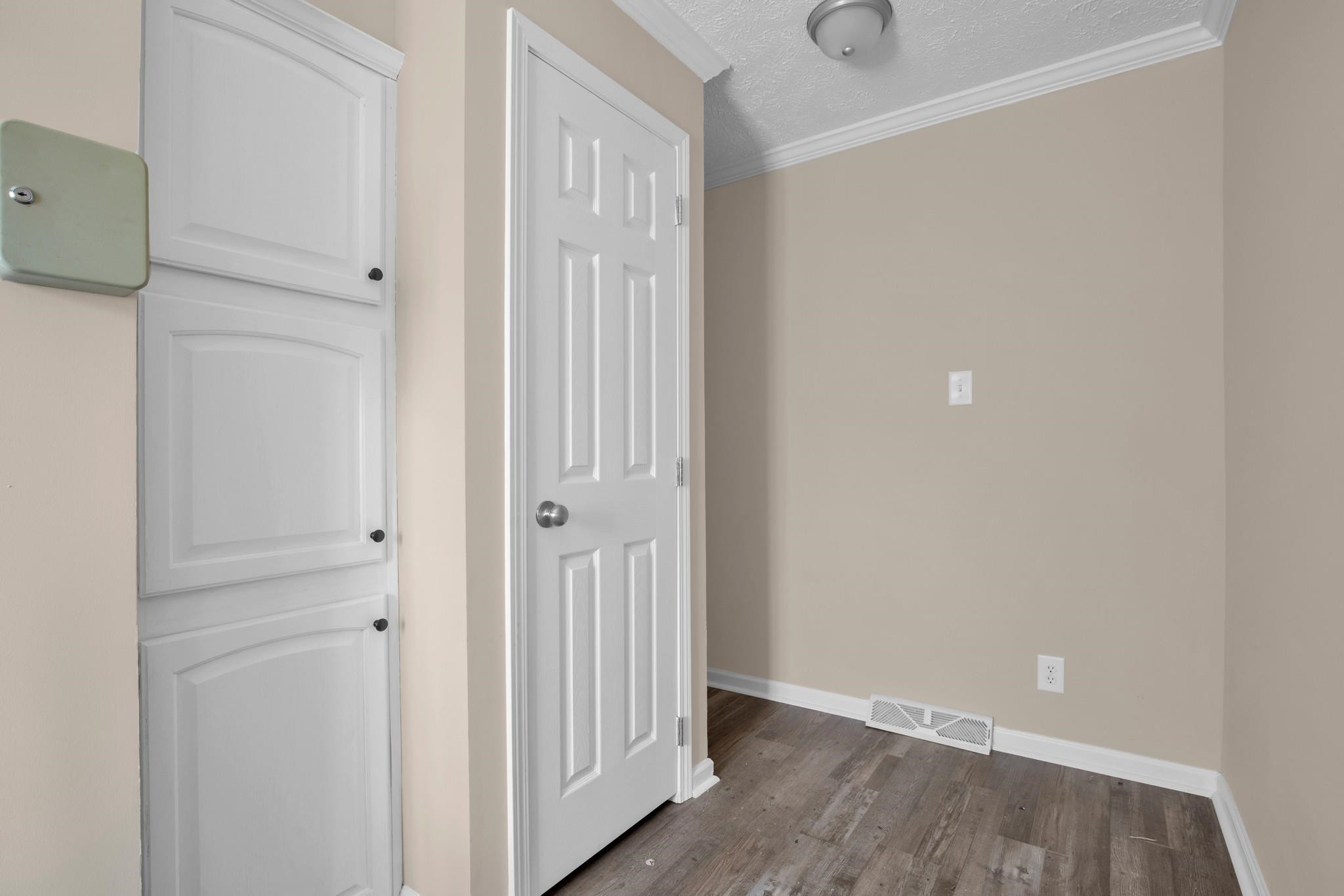 2380 Byrds Mill Road Erwin, NC 28339 - Photo 13 of 36 a view of a hallway with wooden floor