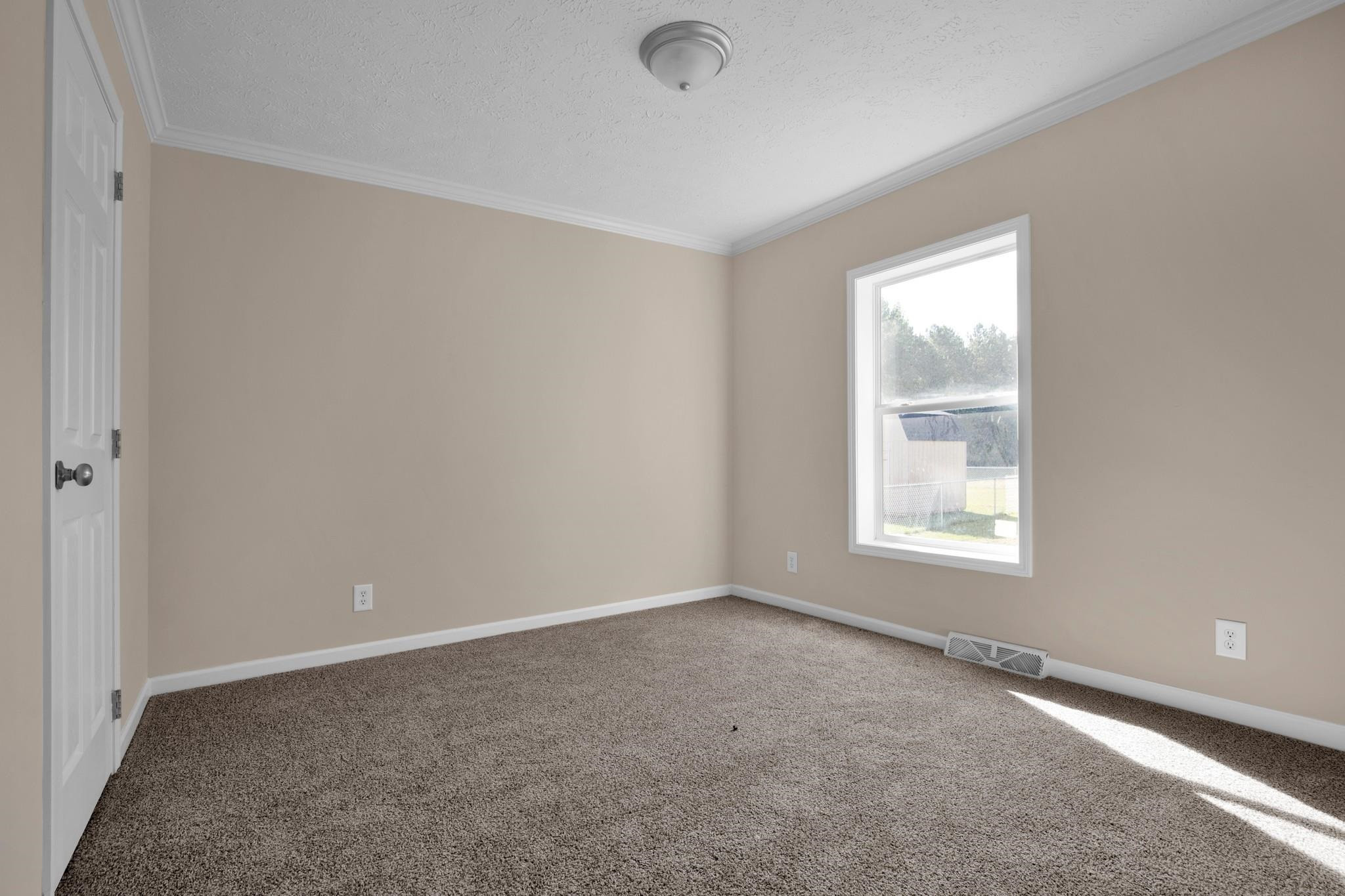 2380 Byrds Mill Road Erwin, NC 28339 - Photo 14 of 36 an empty room with a window