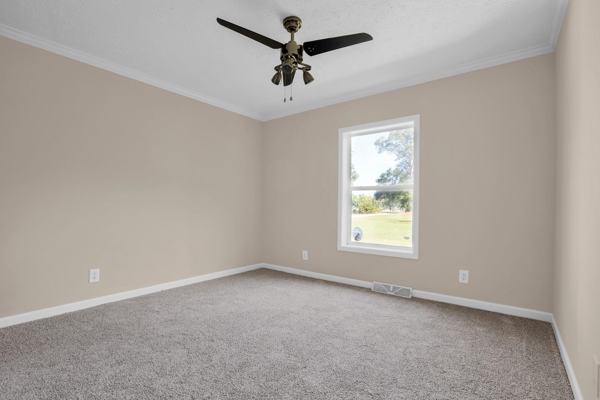 2380 Byrds Mill Road Erwin, NC 28339 - Photo 19 of 36 an empty room with a window and a fan