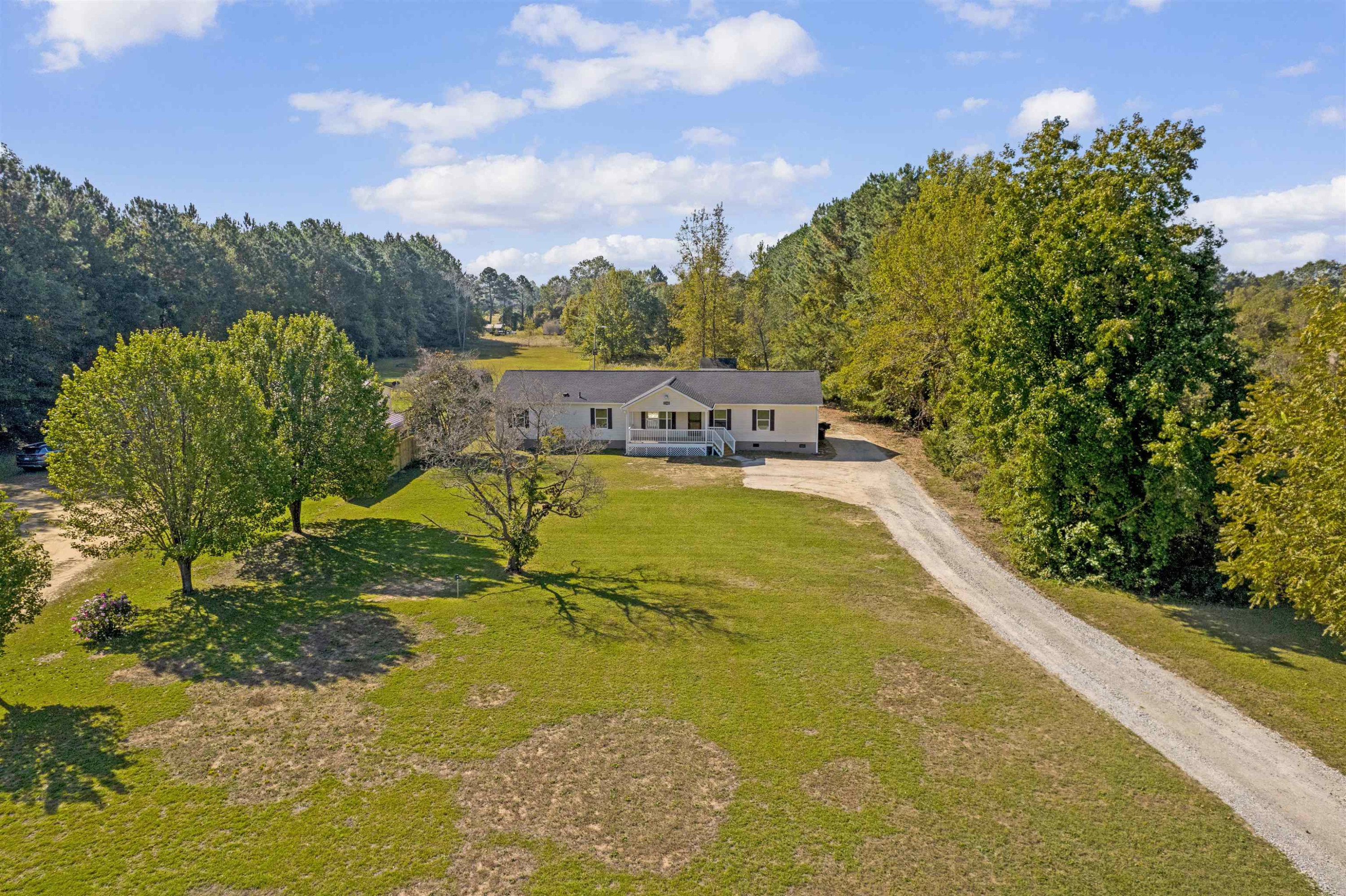 2380 Byrds Mill Road Erwin, NC 28339 - Photo 2 of 36 a view of a swimming pool with a yard