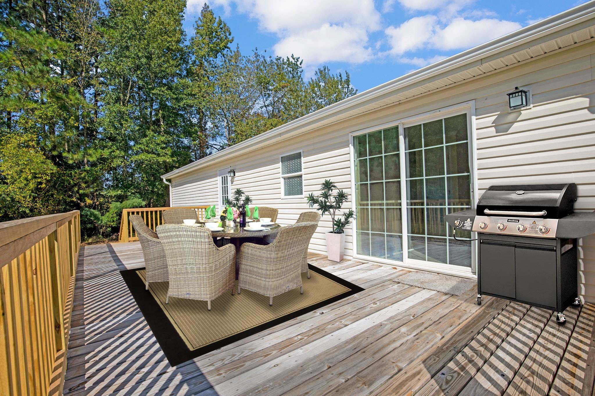 2380 Byrds Mill Road Erwin, NC 28339 - Photo 27 of 36 a view of a patio with table and chairs