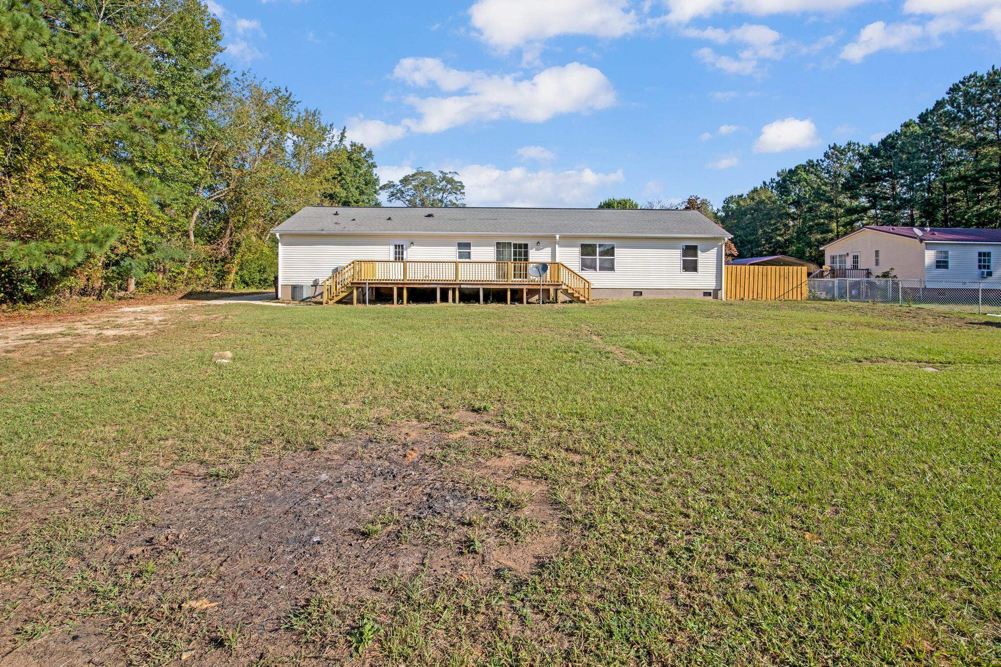 2380 Byrds Mill Road Erwin, NC 28339 - Photo 28 of 36 a front view of a house with a garden