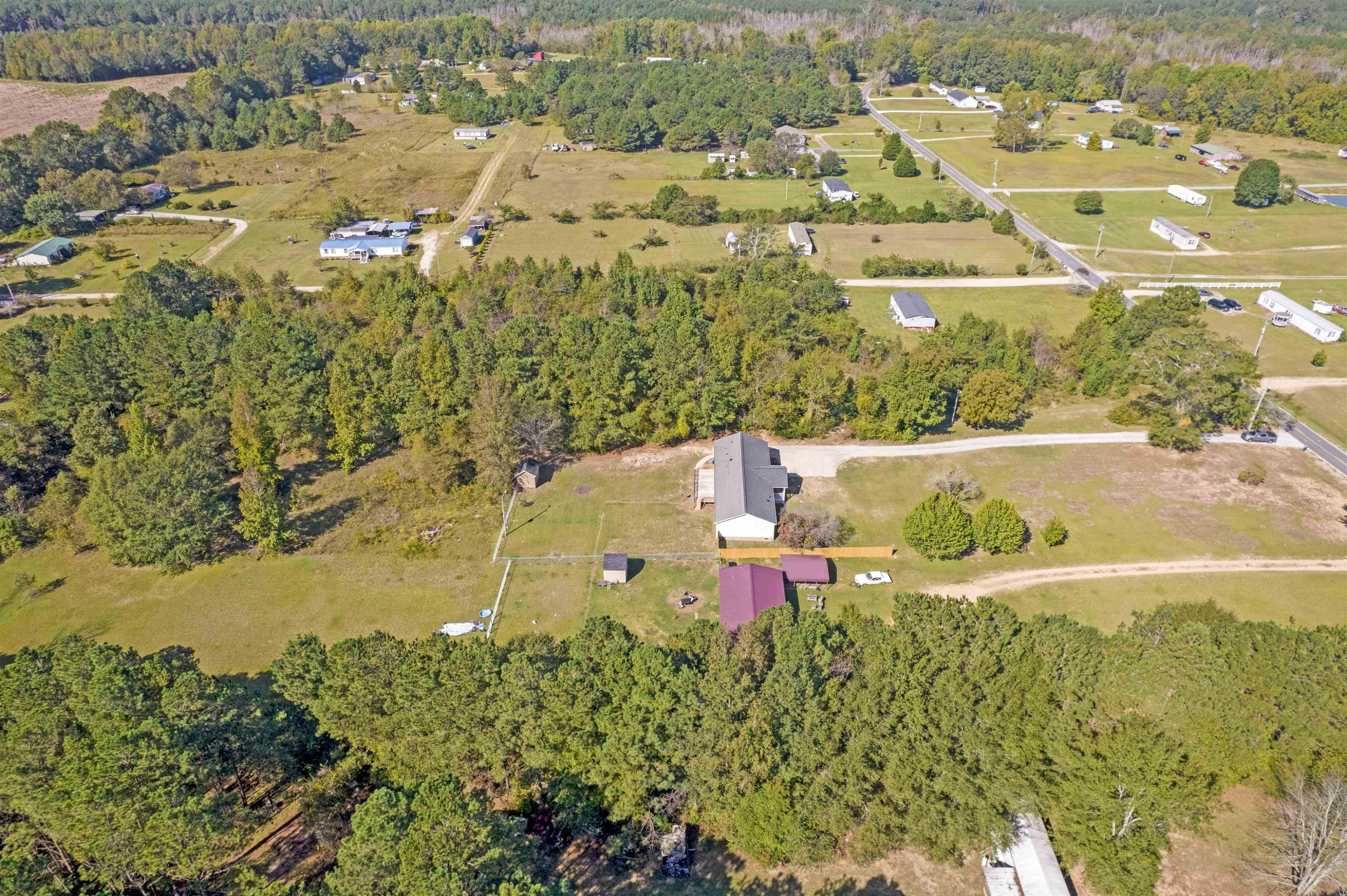 2380 Byrds Mill Road Erwin, NC 28339 - Photo 33 of 36 an aerial view of residential houses with outdoor space
