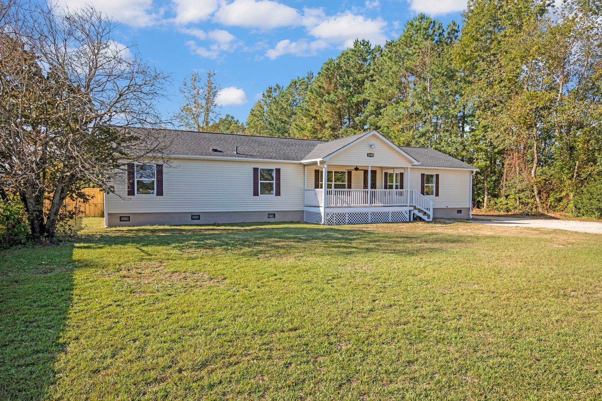 2380 Byrds Mill Road Erwin, NC 28339 - Photo 4 of 36 a front view of a house with swimming pool