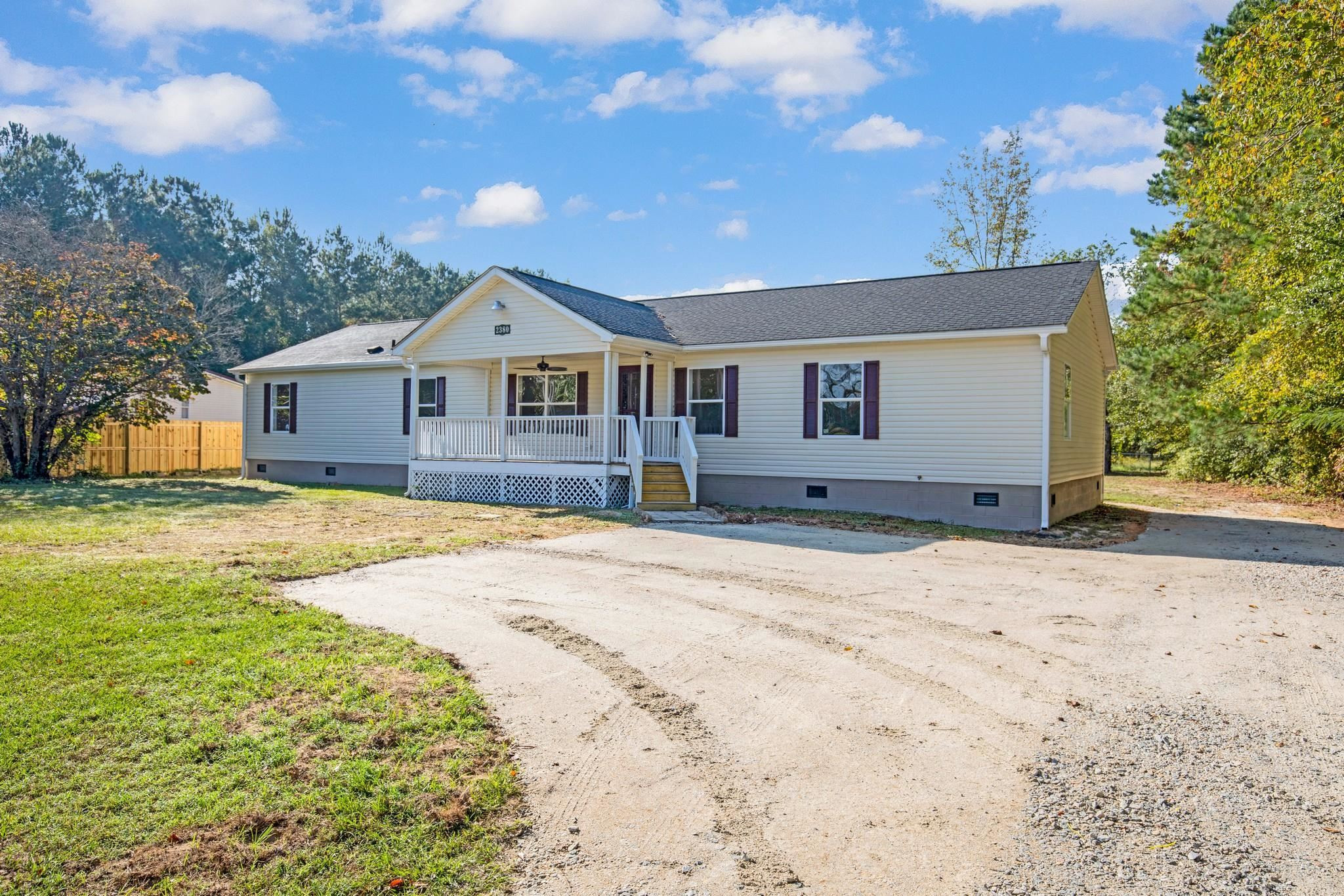 2380 Byrds Mill Road Erwin, NC 28339 - Photo 5 of 36 a front view of a house with a yard and garage