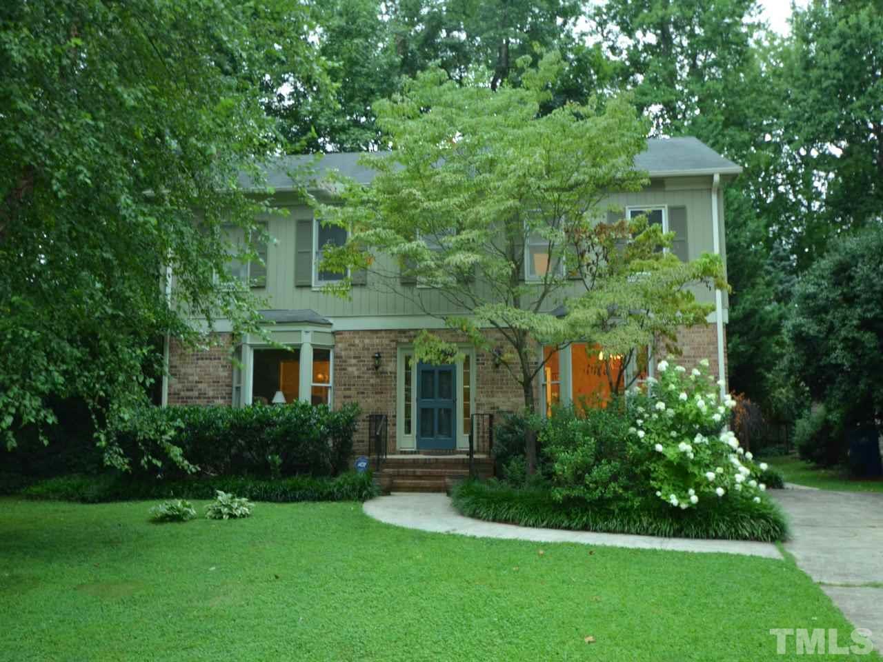 2821 Old Orchard Road Raleigh, NC 27607 - Photo 1 of 25 a front view of a house with a yard