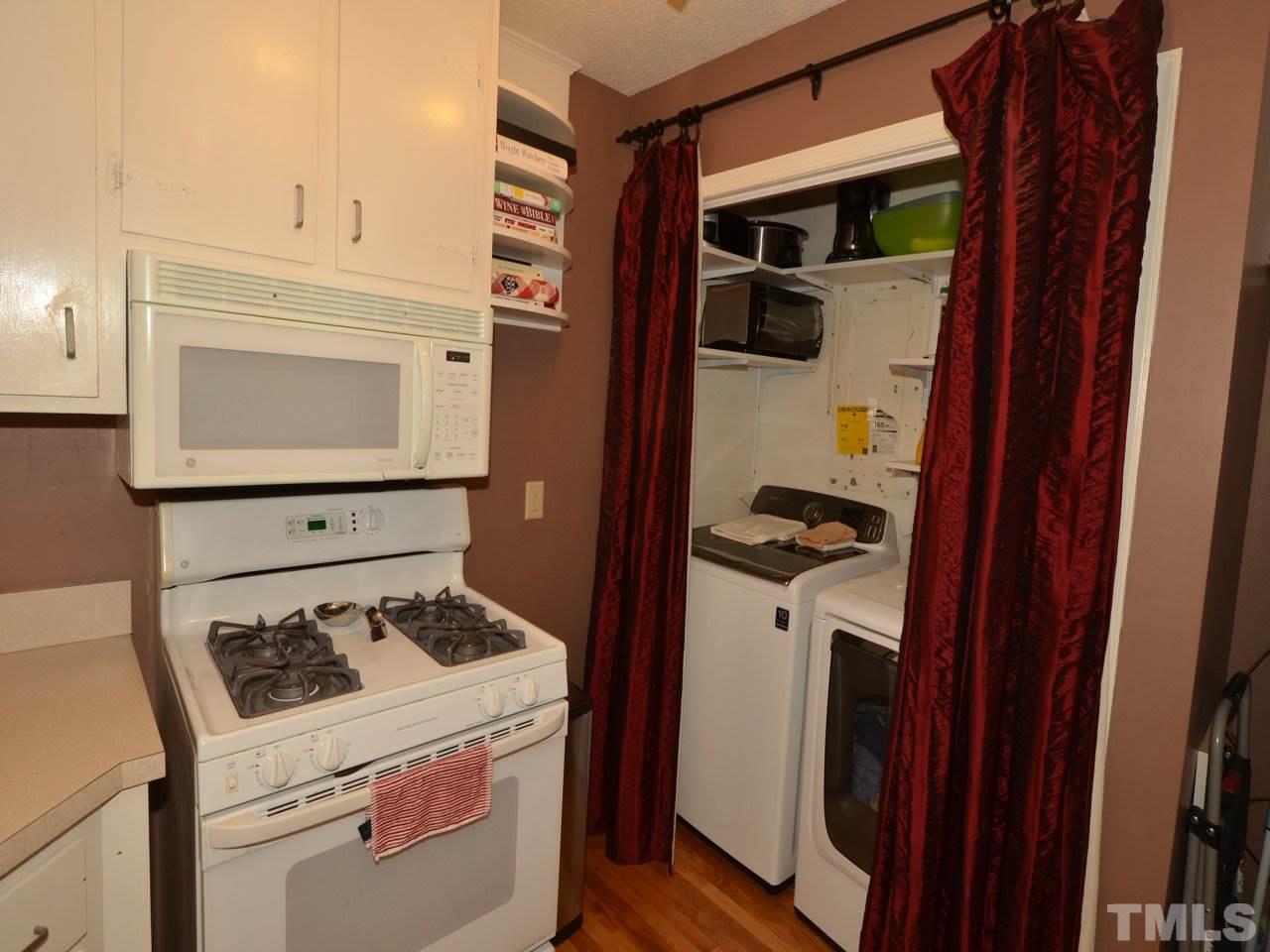 2821 Old Orchard Road Raleigh, NC 27607 - Photo 15 of 25 a kitchen with a stove and a microwave