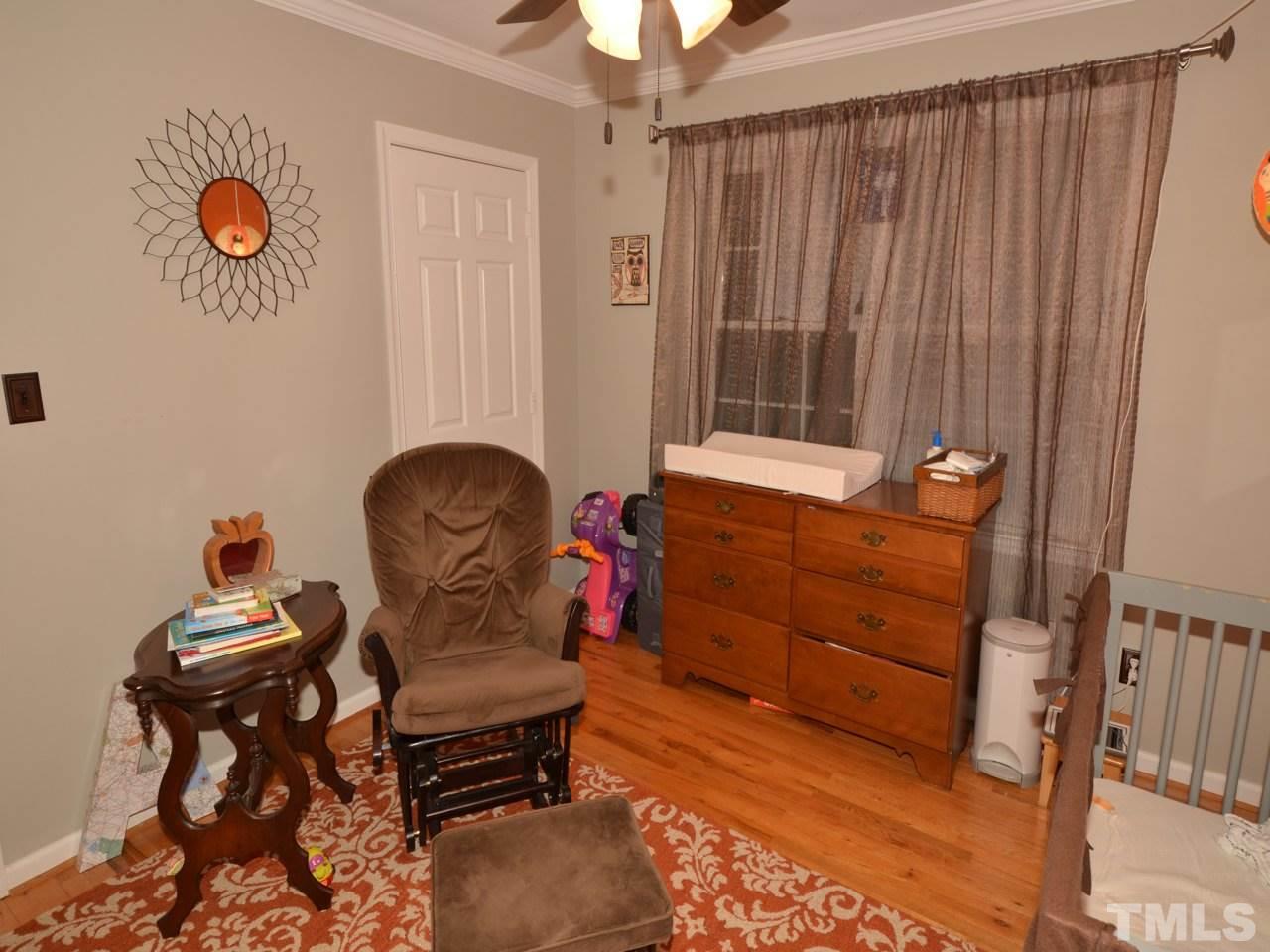 2821 Old Orchard Road Raleigh, NC 27607 - Photo 19 of 25 a room with furniture and a window