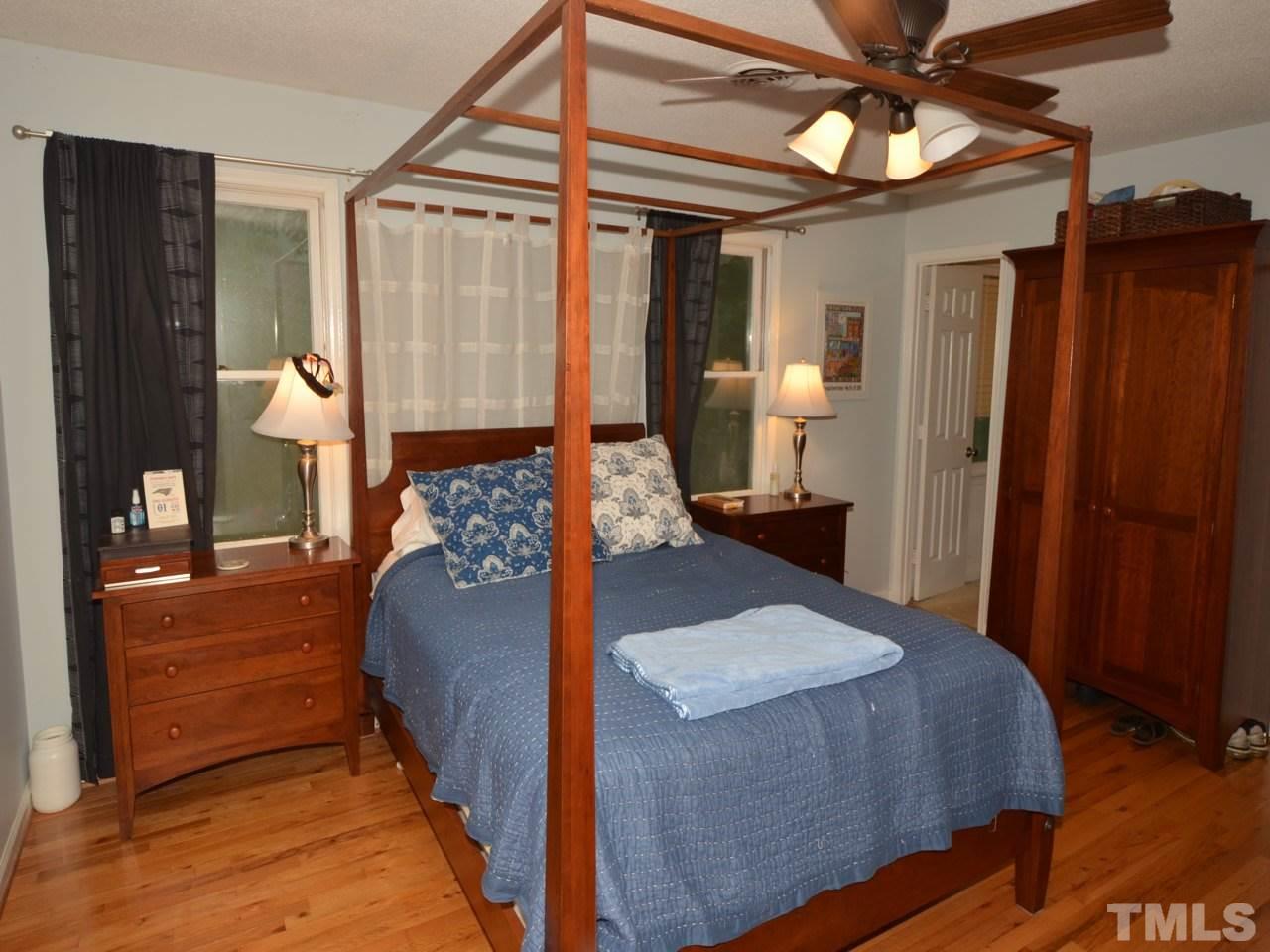 2821 Old Orchard Road Raleigh, NC 27607 - Photo 22 of 25 a living room with furniture and a chandelier