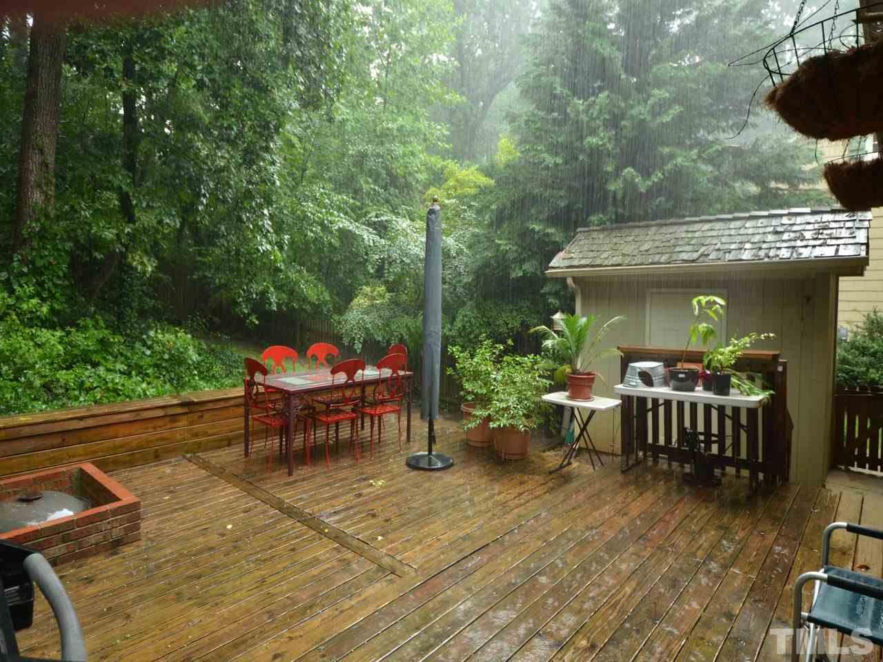 2821 Old Orchard Road Raleigh, NC 27607 - Photo 24 of 25 a view of a patio with table and chairs potted plants with wooden floor