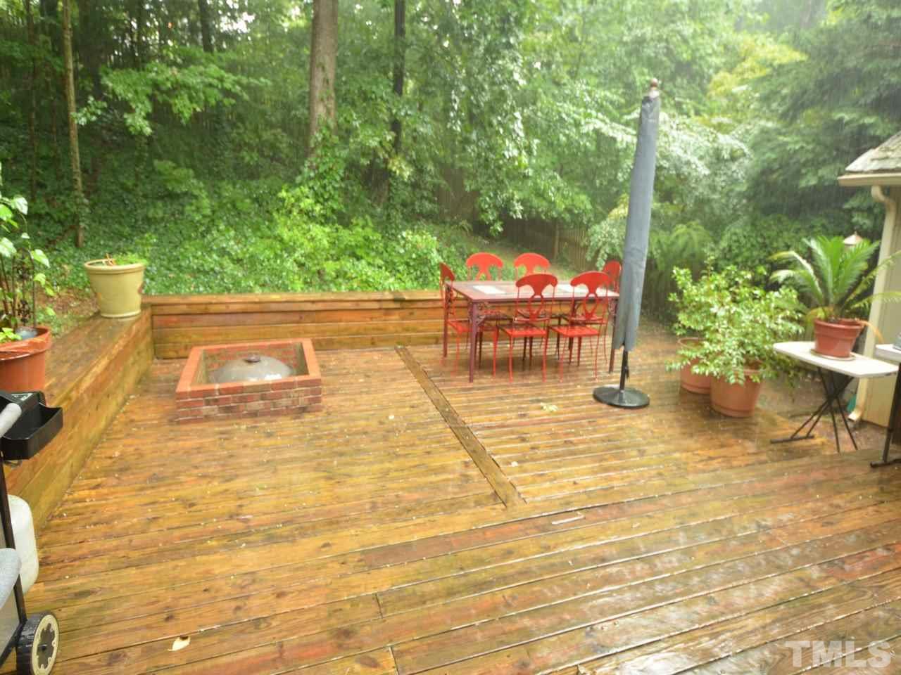 2821 Old Orchard Road Raleigh, NC 27607 - Photo 25 of 25 a backyard of a house with table and chairs