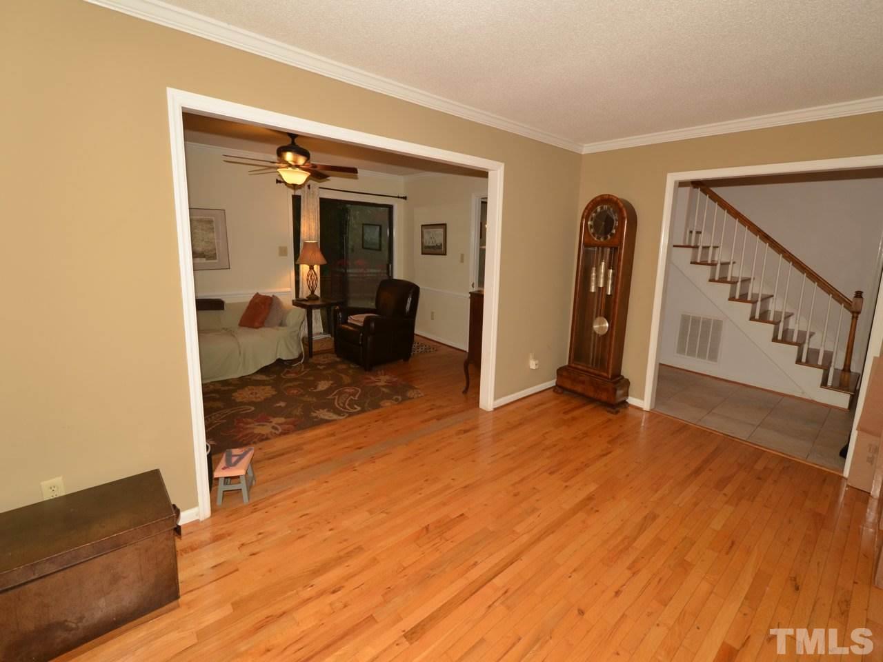 2821 Old Orchard Road Raleigh, NC 27607 - Photo 6 of 25 a view of a room with wooden floor and furniture