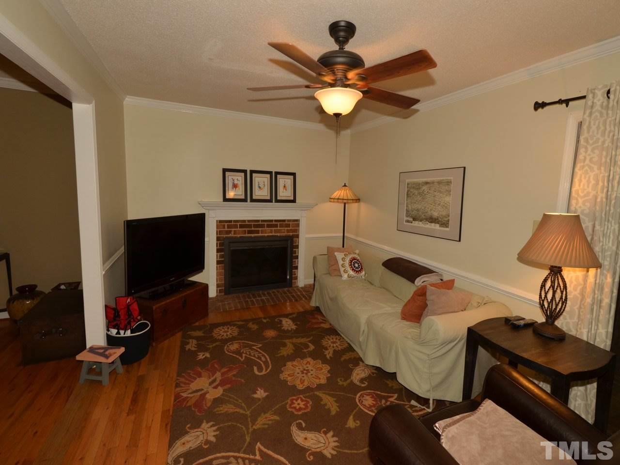 2821 Old Orchard Road Raleigh, NC 27607 - Photo 8 of 25 a living room with furniture and a flat screen tv