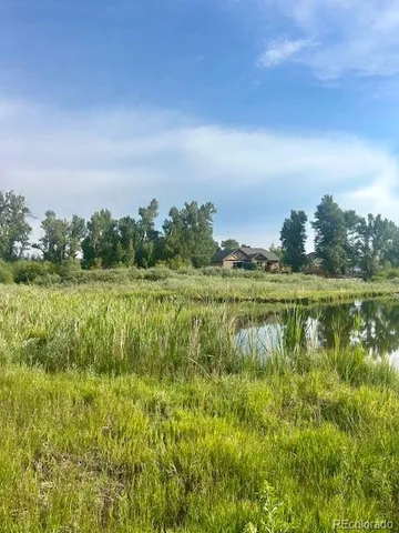 a view of a lake with a big yard
