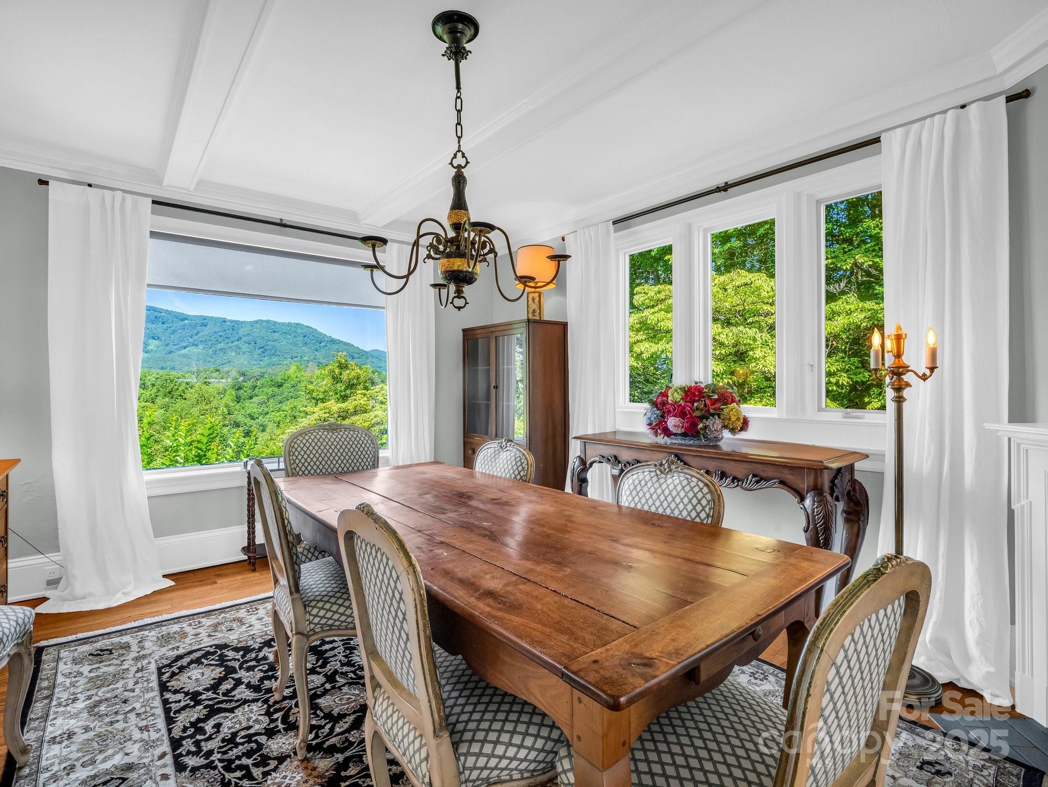 287 Pacolet Ridge Lane Tryon, NC 28782 - Photo 12 of 48 a dining room with furniture window wooden floor