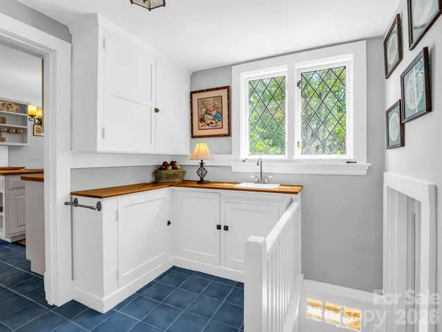 a living room with furniture and a gate