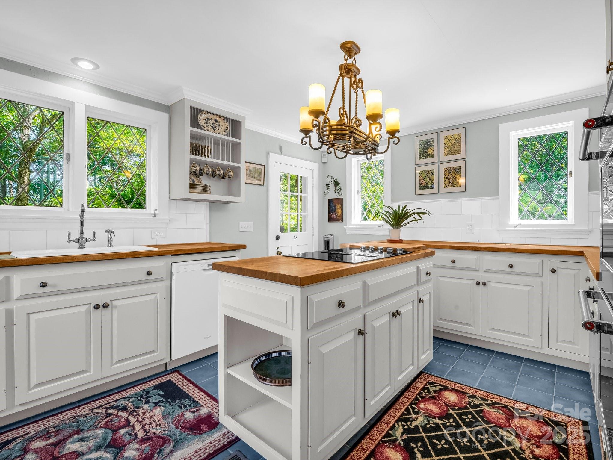 287 Pacolet Ridge Lane Tryon, NC 28782 - Photo 16 of 48 a kitchen with a sink stove and cabinets