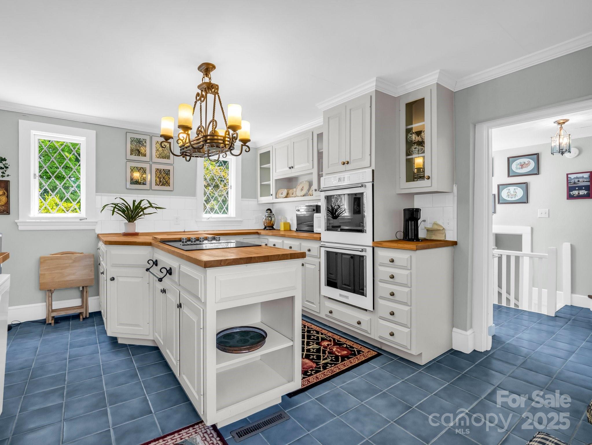 287 Pacolet Ridge Lane Tryon, NC 28782 - Photo 17 of 48 a kitchen with a stove and a white cabinets